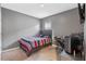 Bedroom with striped bedding, desk, and gaming chair at 3101 Royal Tern Dr, Winter Haven, FL 33881