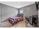 Bedroom with striped bedding, desk, and gaming chair at 3101 Royal Tern Dr, Winter Haven, FL 33881