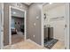 Hallway with laundry room and bedroom access at 3101 Royal Tern Dr, Winter Haven, FL 33881