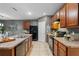 Modern kitchen with stainless steel appliances and breakfast bar at 3101 Royal Tern Dr, Winter Haven, FL 33881