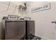 Laundry room with washer, dryer, and shelving at 3101 Royal Tern Dr, Winter Haven, FL 33881