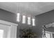 Modern four-light fixture with cylindrical glass shades at 3101 Royal Tern Dr, Winter Haven, FL 33881