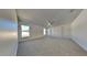 Main bedroom with carpeted floors and ceiling fan at 3342 Saint Vincent Ln, Clermont, FL 34711