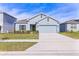 Light blue single-Gathering home with a two-car garage at 3979 Ambrose Ave, Kissimmee, FL 34746