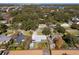 Aerial view of a house and surrounding neighborhood, showcasing the property's location and setting at 402 Oak Lynn Dr, Orlando, FL 32809