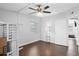 Well lit bedroom with hardwood floors and window coverings at 402 Oak Lynn Dr, Orlando, FL 32809