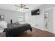 Main bedroom with ensuite bathroom and large TV at 402 Oak Lynn Dr, Orlando, FL 32809