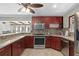 Spacious kitchen with wood cabinets and tile backsplash at 402 Oak Lynn Dr, Orlando, FL 32809