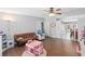 Bright living room, hardwood floors, view to kitchen at 402 Oak Lynn Dr, Orlando, FL 32809