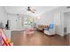 Bright living room featuring hardwood floors and comfy seating at 402 Oak Lynn Dr, Orlando, FL 32809