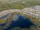 Aerial view showing a house's location near a lake in a residential area at 4530 Tahoe Cir, Clermont, FL 34714