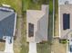 Aerial view of house showcasing solar panels on the roof at 4530 Tahoe Cir, Clermont, FL 34714