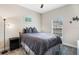 Cozy bedroom with a full-size bed and window at 4530 Tahoe Cir, Clermont, FL 34714