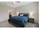 Main bedroom with large bed, ensuite bathroom access, and nightstands at 4530 Tahoe Cir, Clermont, FL 34714