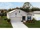 Single-story home with solar panels and attractive landscaping at 4530 Tahoe Cir, Clermont, FL 34714