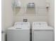 Laundry room with washer and dryer and shelving at 4530 Tahoe Cir, Clermont, FL 34714