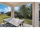 Covered patio with table and chairs, overlooking the backyard at 4530 Tahoe Cir, Clermont, FL 34714