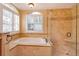 Spa-like bathroom with soaking tub and walk-in shower at 4832 Shoreline Cir, Sanford, FL 32771