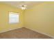 Bedroom with neutral walls, ceiling fan and window at 4832 Shoreline Cir, Sanford, FL 32771