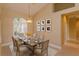 Bright dining room with a rustic table and chandelier, perfect for Gathering gatherings at 4832 Shoreline Cir, Sanford, FL 32771