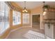 Bright kitchen nook boasts a bay window and view of the pool at 4832 Shoreline Cir, Sanford, FL 32771