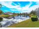 Stunning lake view with lush landscaping and beautiful homes at 4832 Shoreline Cir, Sanford, FL 32771