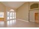 Living area with high ceilings, tiled floors, and French doors leading to the pool at 4832 Shoreline Cir, Sanford, FL 32771