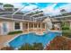 Large screened pool with spa and outdoor kitchen at 4832 Shoreline Cir, Sanford, FL 32771