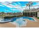 Inviting screened pool and spa with lake view at 4832 Shoreline Cir, Sanford, FL 32771