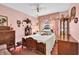 Bedroom with antique wooden bed and pink color scheme at 5408 Kalmia Dr, Orlando, FL 32807