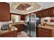 Modern kitchen with stainless steel appliances and wood cabinets at 5408 Kalmia Dr, Orlando, FL 32807