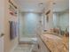 Bathroom with walk-in shower and granite countertop at 5501 S Atlantic Ave # 4150, New Smyrna Beach, FL 32169