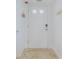 Bright condo entry with white door and beige tile floor at 5501 S Atlantic Ave # 4150, New Smyrna Beach, FL 32169