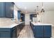 Spacious kitchen featuring modern cabinetry, center island, and quartz countertops at 6145 Citrus Grove Ct, St Cloud, FL 34771