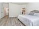 Main bedroom with a king-size bed and access to the ensuite bathroom at 6145 Citrus Grove Ct, St Cloud, FL 34771