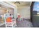 Relaxing screened porch with rocking chairs and brick pavers at 6145 Citrus Grove Ct, St Cloud, FL 34771