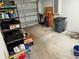 Attached garage with storage shelving and space for one vehicle at 7047 Sw 131St Loop, Ocala, FL 34473