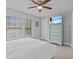 Bright bedroom with a queen-size bed and large windows at 715 Siena Palm Dr, Celebration, FL 34747