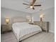 Spacious bedroom with king-size bed, light gray walls, and ceiling fan at 715 Siena Palm Dr, Celebration, FL 34747