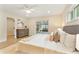 Bright bedroom featuring a ceiling fan, an exit to the patio, and a decorative dresser at 7884 Broken Arrow Trl, Winter Park, FL 32792