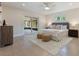 Bedroom features a ceiling fan, an exit to the patio, and stylish decor at 7884 Broken Arrow Trl, Winter Park, FL 32792