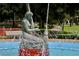 Beautiful fountain featuring a statue, surrounded by a tranquil park setting at 7884 Broken Arrow Trl, Winter Park, FL 32792