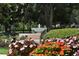 Community park fountain with benches and colorful flowers at 7884 Broken Arrow Trl, Winter Park, FL 32792