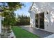 Modern backyard with gray deck, artificial turf, and landscaping at 830 W Canton Ave, Winter Park, FL 32789