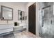 Modern bathroom with double sinks, large shower, and gray marble tile at 830 W Canton Ave, Winter Park, FL 32789