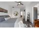 Spacious bedroom with gray bedding, large mirror, and access to another bedroom at 830 W Canton Ave, Winter Park, FL 32789