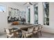 Elegant dining room with a long wooden table and modern lighting at 830 W Canton Ave, Winter Park, FL 32789