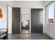 Clean hallway with dark gray doors and hardwood floors at 830 W Canton Ave, Winter Park, FL 32789