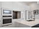 Modern kitchen with white cabinets, marble countertops, and stainless steel appliances at 830 W Canton Ave, Winter Park, FL 32789