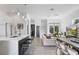 Modern kitchen with white cabinets and a large island at 830 W Canton Ave, Winter Park, FL 32789